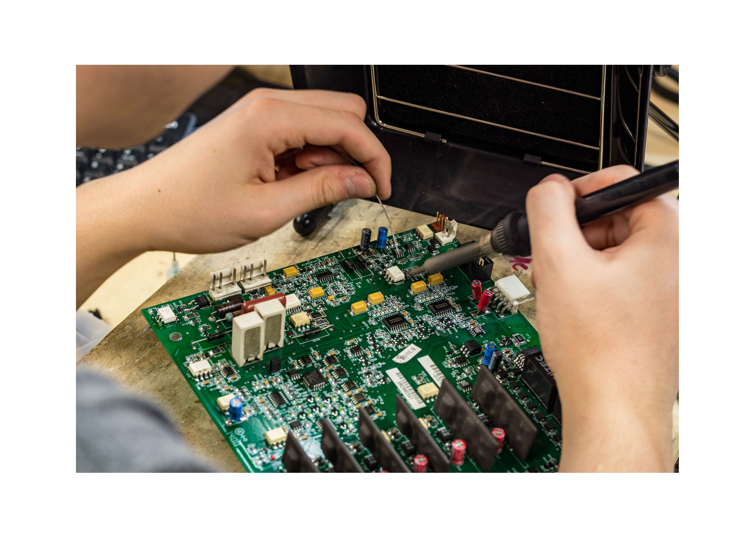 Technician working on a circuit board