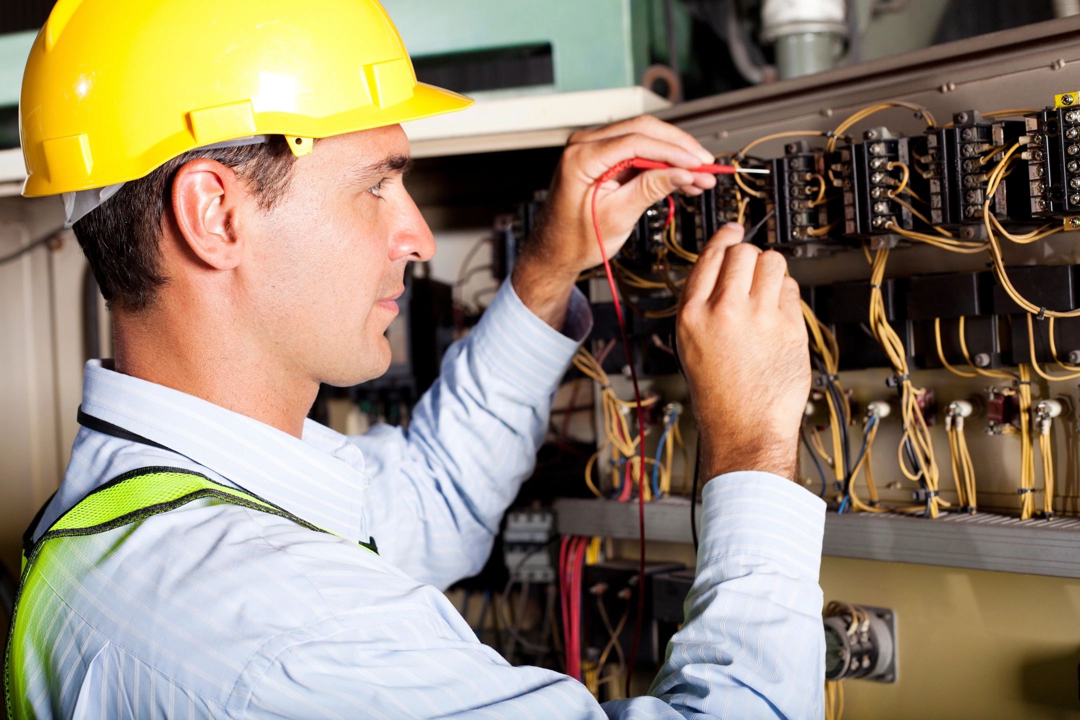 Technician with yellow hardhat working